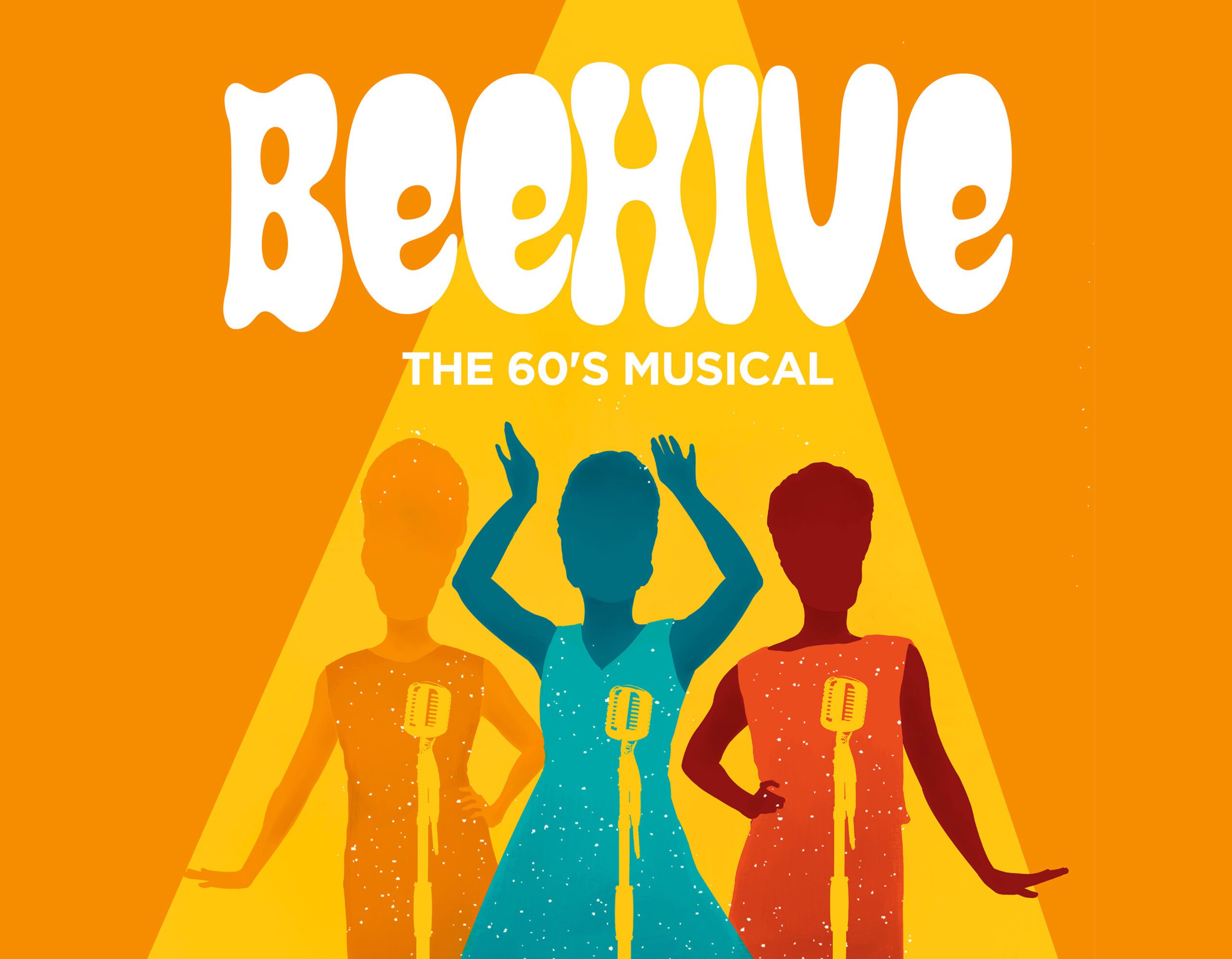 A retro girl group performing on stage.
