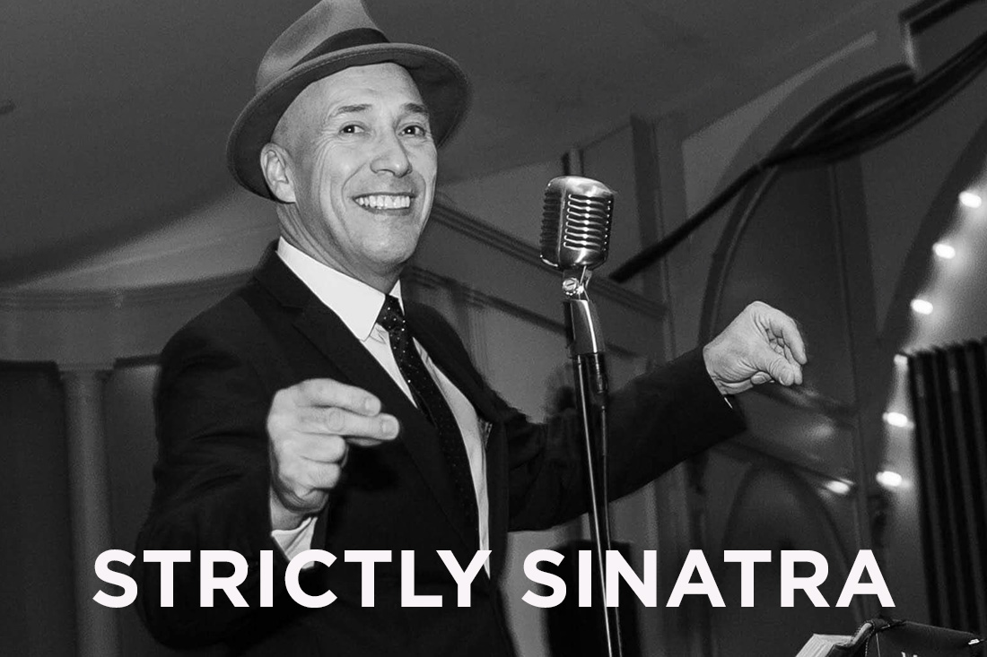 Frank Sinatra tribute singer performing into a microphone.